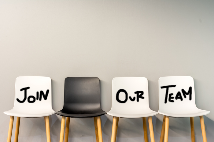 row of chairs reading 'join our team'